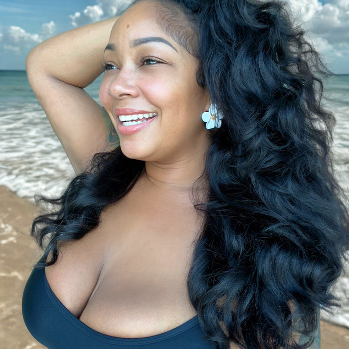 Woman with long, wavy hair on a beach